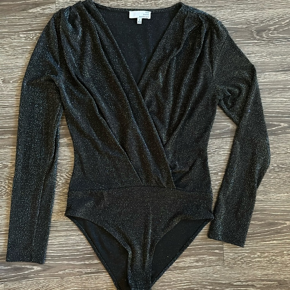 Black glimmer body suit.